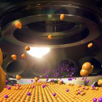 Molecular beam epitaxy system photo with illustration of thin-film growth process