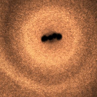 Moving Microswimmers using Magnetic Vortices