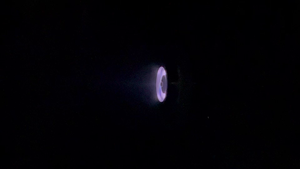 Plasma coming out of a unique, fuel-efficient thruster for small satellites, built by Aliena