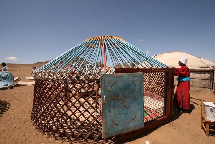 A person constructing a ger for a local festivity.