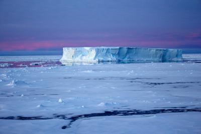 Tabular Iceberg Surrounded By Sea Ice In The Antarctic