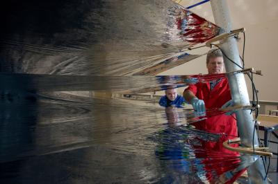 Engineer Handling the Sunshield Membrane