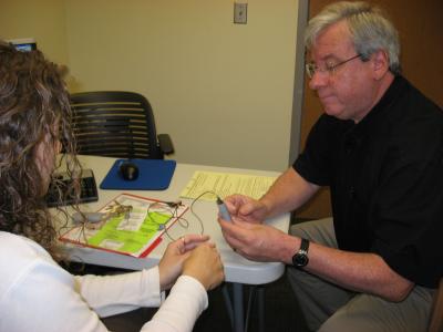 Patient Examines New Vestibular Device