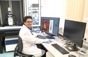 Dr. Sanjai Karanth working with the atomic force microscope