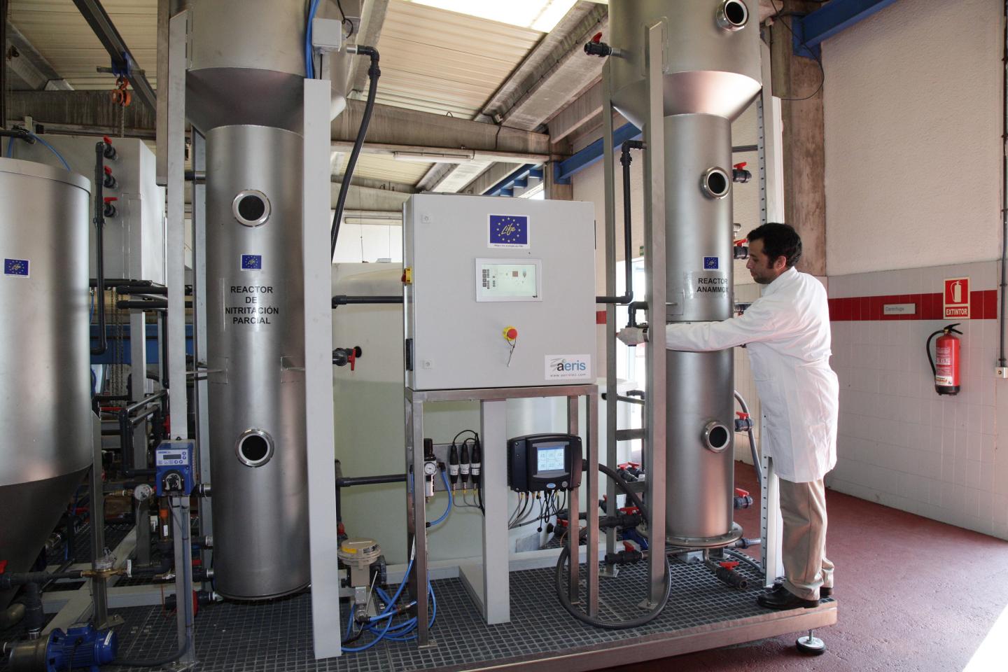 A Researcher from the UAB Operates the Experimental Plant