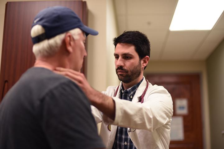 Brian Hess, M.D., with a patient