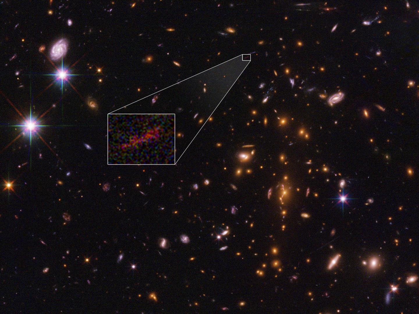 Zoom Lens in Space Stretches Image of One of Farthest Galaxies Yet Seen