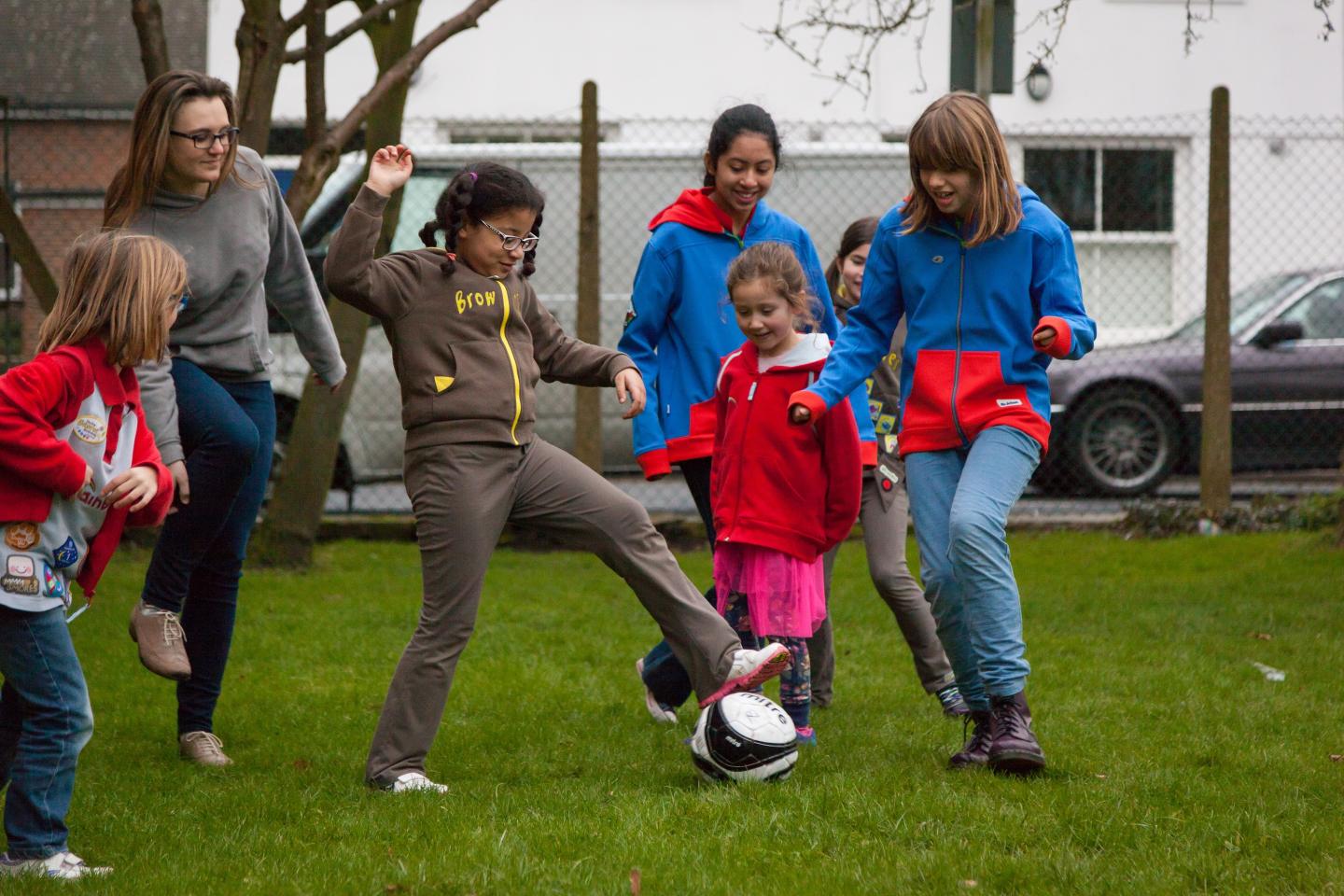 Girls from Rainbows, Brownies, Guides and Senior Section Play Football