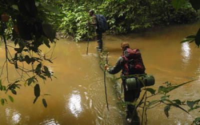 Students Cross a Storm-Swollen River in Gabon