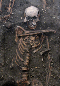 Skeleton of young adult male buried in the grounds of a medieval charitable hospital in Cambridge, UK