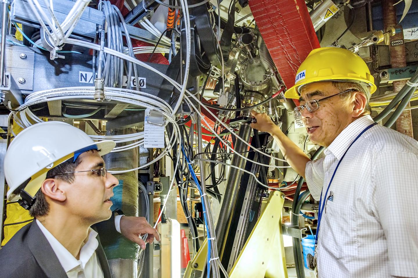 PPPL Physicists Robert Kaita and Michael Jaworski in Front of the National Spherical Torus Experimen