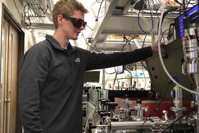 Clay Klein, working in his lab at JILA.