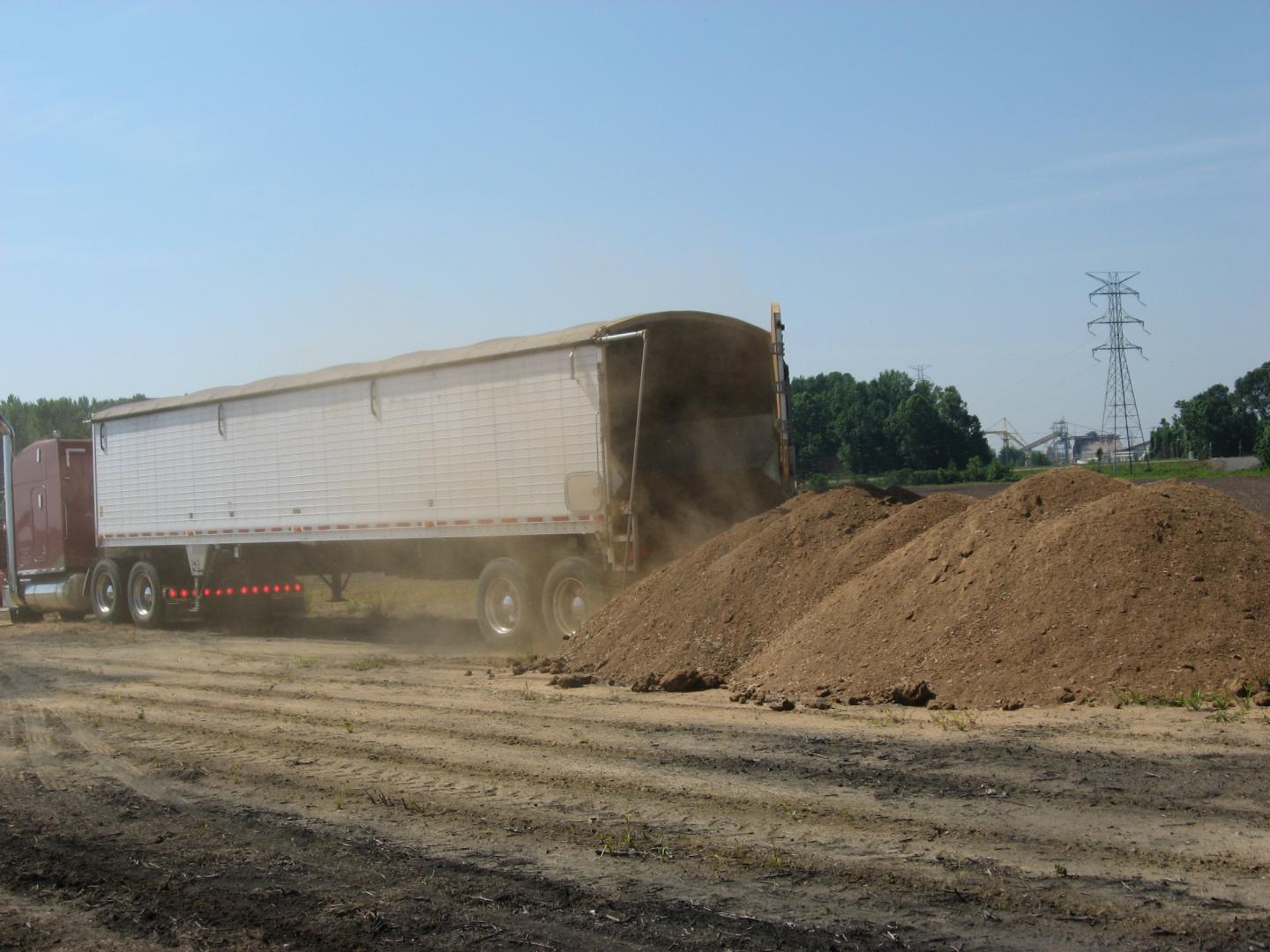 Spreading Chicken Litter