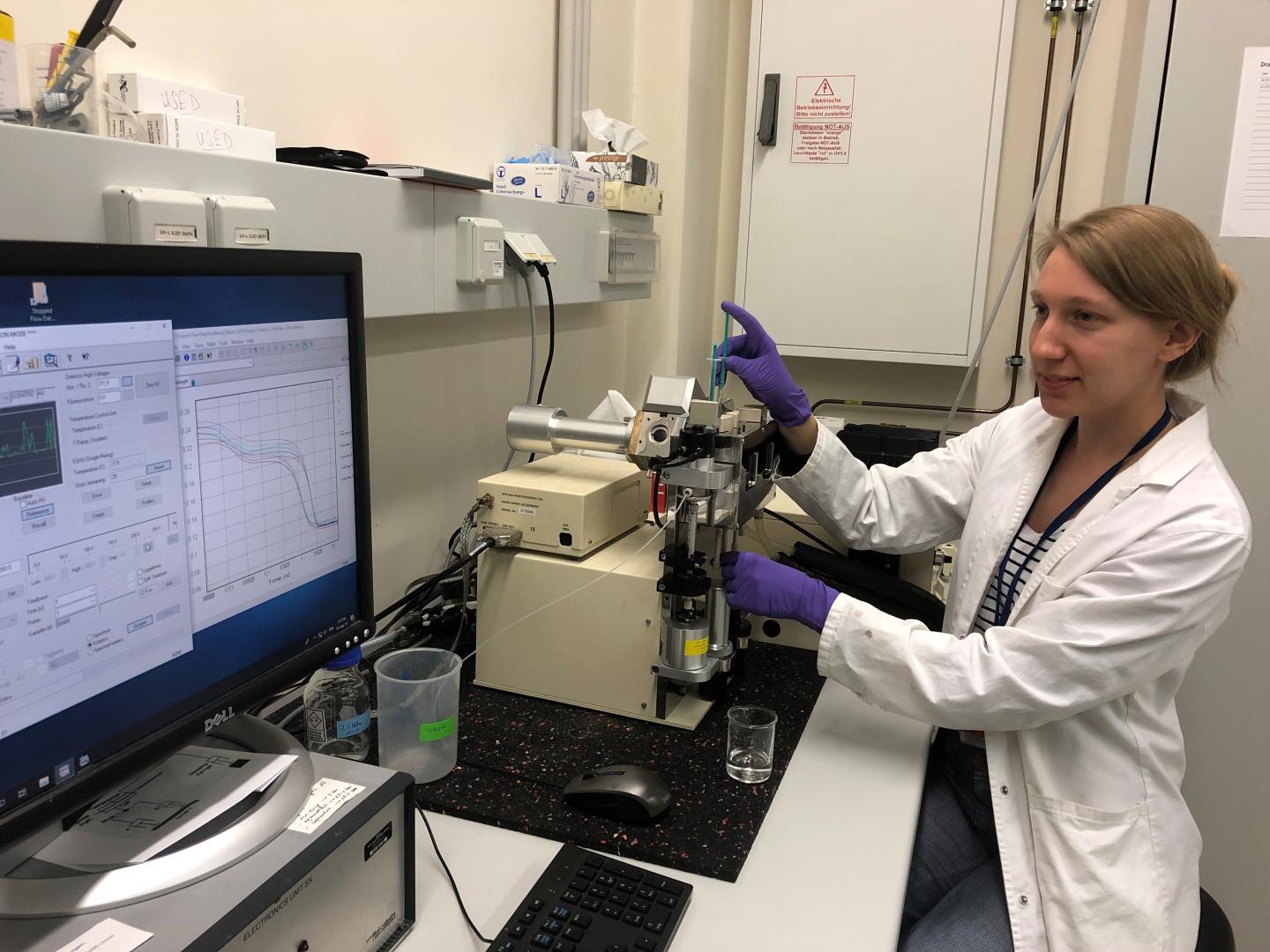 Researcher with Equipment and Computer