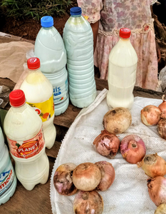 Local milk sold in repurposed water and soda bottles at Bamenda’s cattle market.