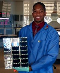 Christopher S. Moore Holding the MinXSS CubeSat