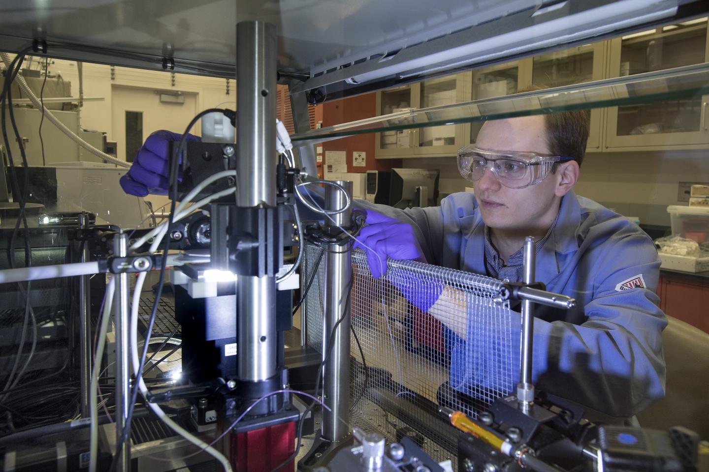 Yale University PhD student Kristof Toth with electrospray deposition tool