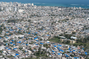 Blue tarps cover damaged roofs in San Juan, Puerto Rico