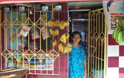 Woman Standing at the Door of her Store