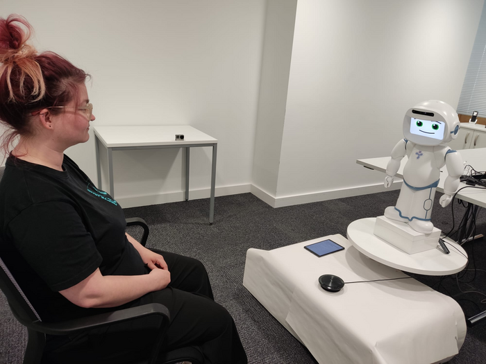 Person interacting with a QTRobot
