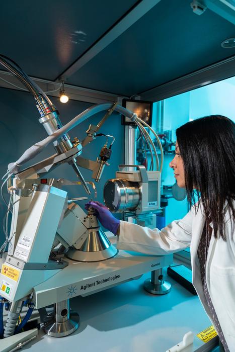 Dr. Shabnam Hematian works with an X-ray diffractometer at UNCG.