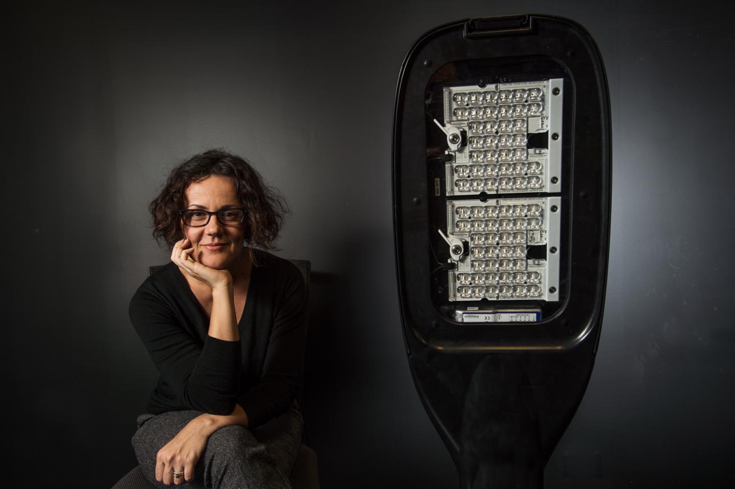 QUT Researcher Dr. Gillian Isoardi with LED Street Light