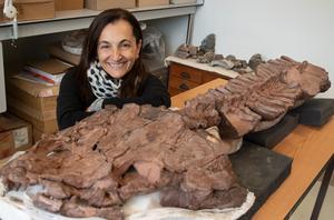 Claudia Marsicano studying the prepared fossil