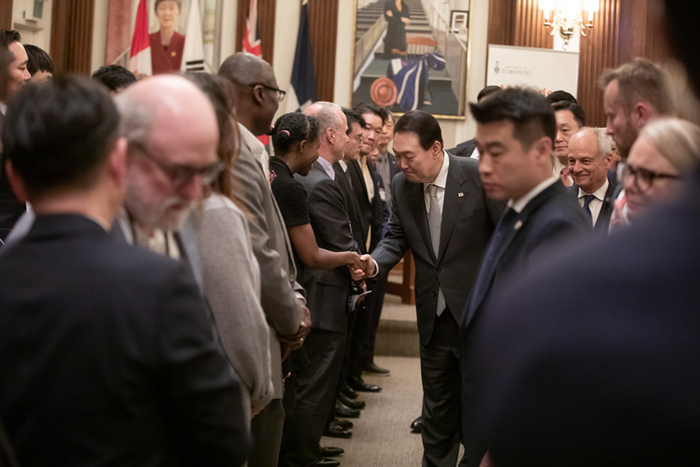 South Korean President Yoon Suk-yeol, U of T President Meric Gertler and Alex Mihailidis