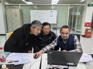 Professor Guo, professor He, and professor Yan, from the Nuclear Analysis Research Center for Lunar Sample at the Department of Nuclear Physics of the China Institute of Atomic Energy, examine experimental results