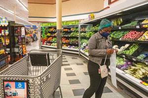 Grocery shopper looking to buy fresh produce.