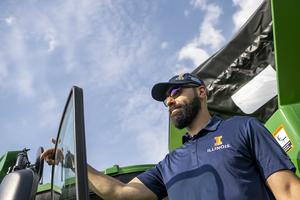 Man posing with tractor