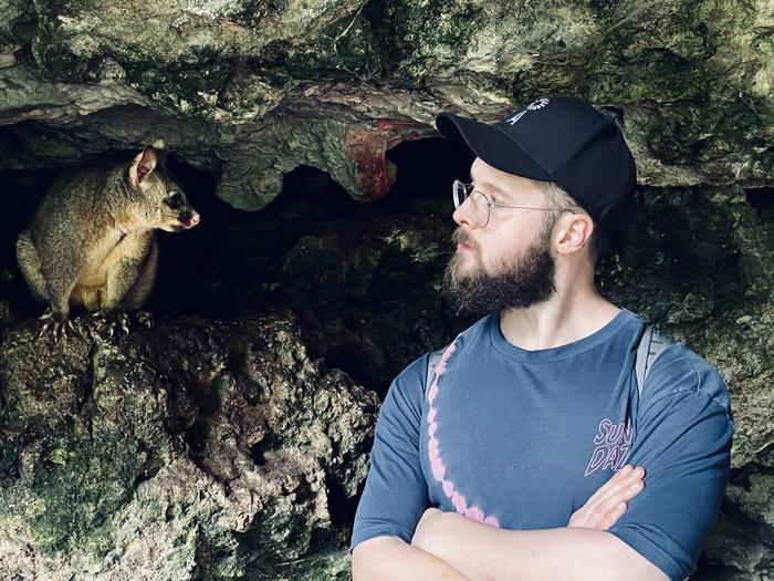 Tom Jameson, who led the research, with a friendly possum
