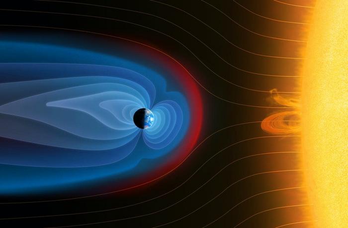 Image 2: Illustration of Earth’s bow shock and magnetic field environment. Particles coming from the Sun interact with Earth’s magnetic field forming a shock wave (called bow shock – shown in red). Credits Mark Garlick/Science Photo Library via Gett