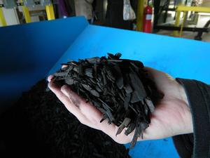 a hand holding biochar