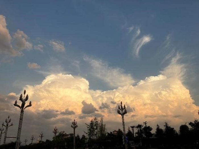 The sunset glow reflected in the eastern clouds over Hanzhong, China. Clouds impact the land surface temperature at different scales, such as through local radiative forcing, large-scale atmospheric circulation, and water vapor, which means it can be “rem