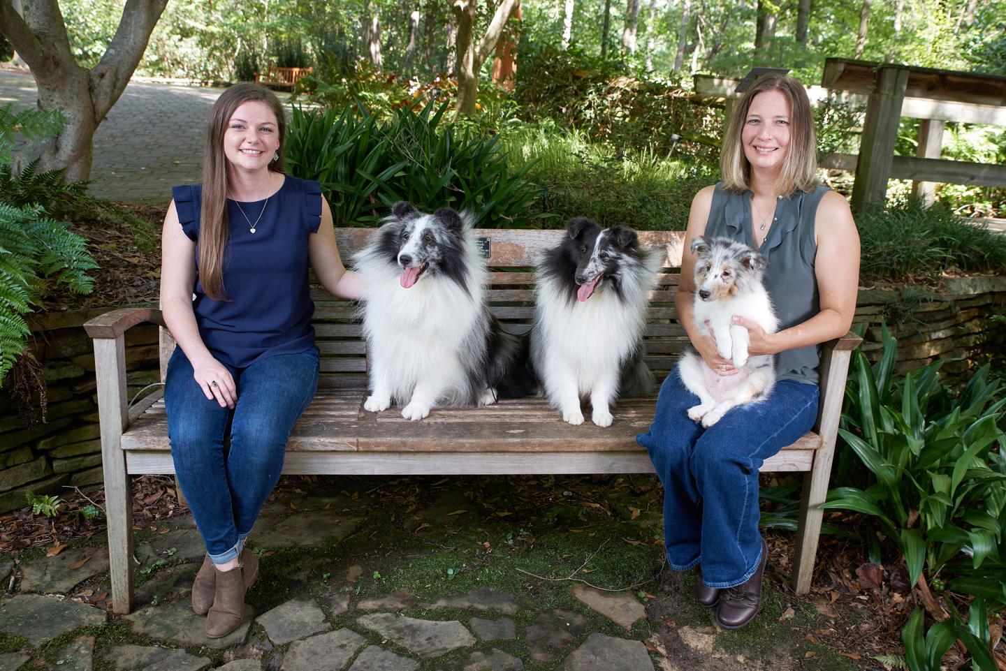 Scientists pose with Shelties