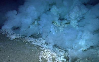 Smoke and Rock Formations on the Bottom of the Ocean Floor
