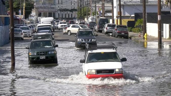 Vehicles on flooded roadway