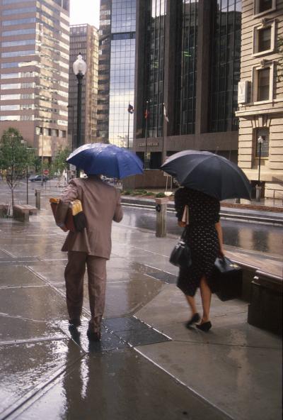 City Dwellers Caught in a Rain Storm