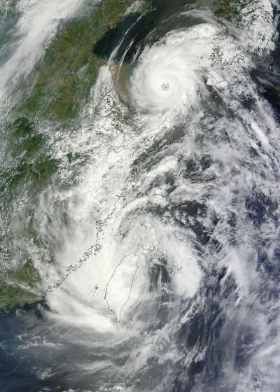 NASA Satellites See Tropical Storm Saola and Typhoon Damrey Arm-in-Arm