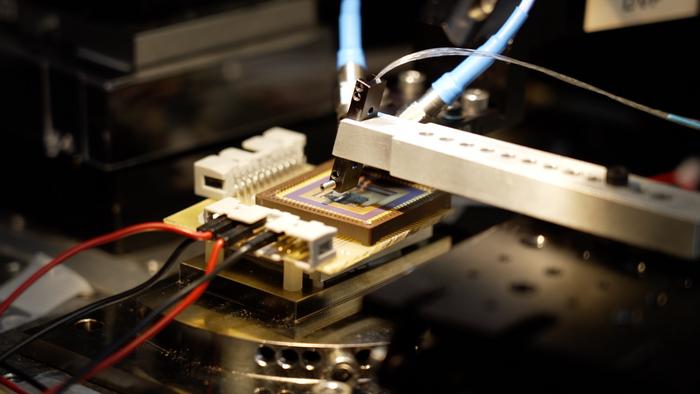 An electro-optic modulator operating with an optical and radio frequency probe station