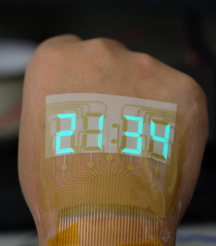 A Stretchable Stopwatch Lights up Human Skin