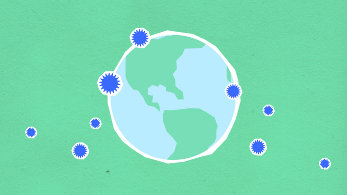 Cardboard composition of the Earth surrounded by bacteria.