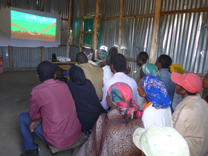 Farmers in Ethiopia watching educational videos