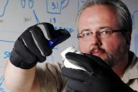 Brad Fain Uses Arthritis Simulation Gloves to Open a Medicine Bottle