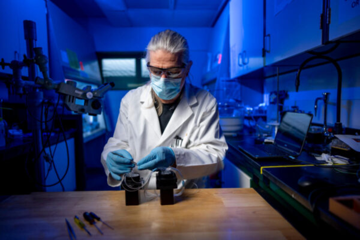 Ron Reiserer works with a prototype