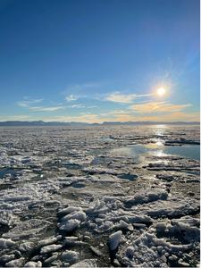 Ice breaking up under a clear blue sky