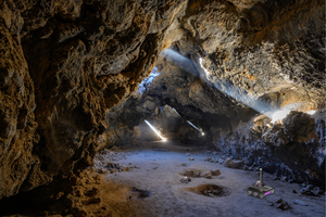 Autonomous rovers exploring a lava tube (artist's impression)