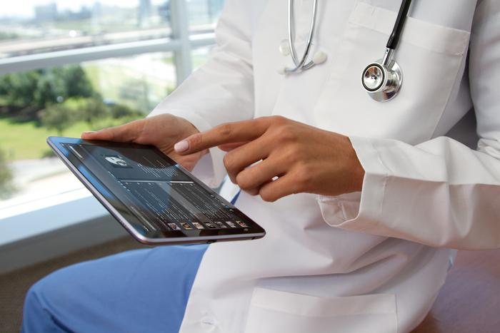 Physician using a tablet computer