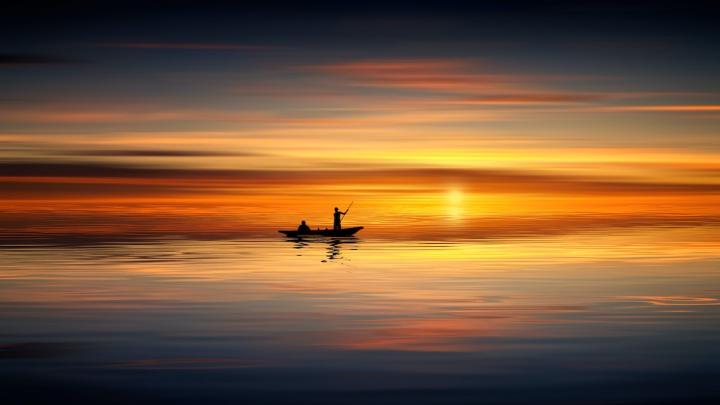 Small Craft on Still, Sunset Ocean